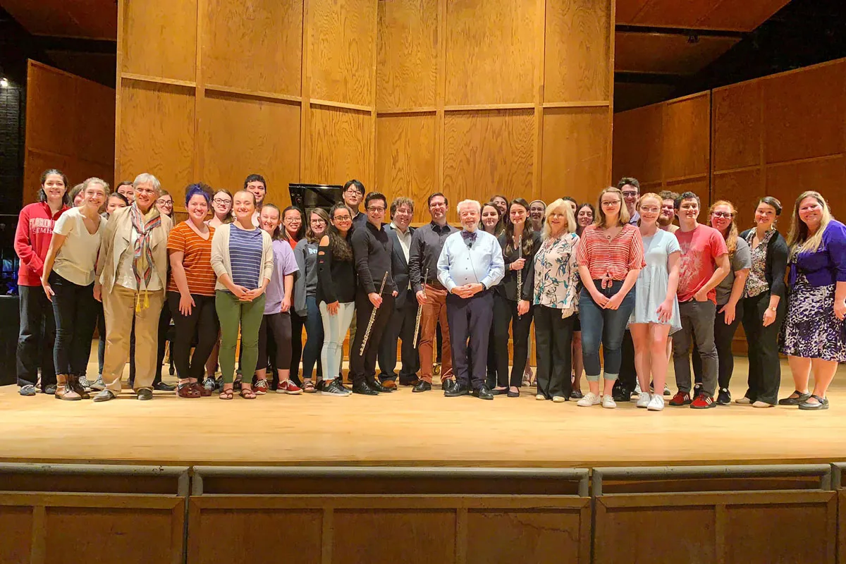 Sir James Galway poses with flute students